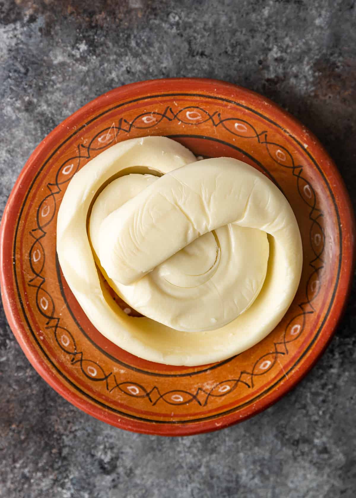 oaxaca cheese swirled on a plate