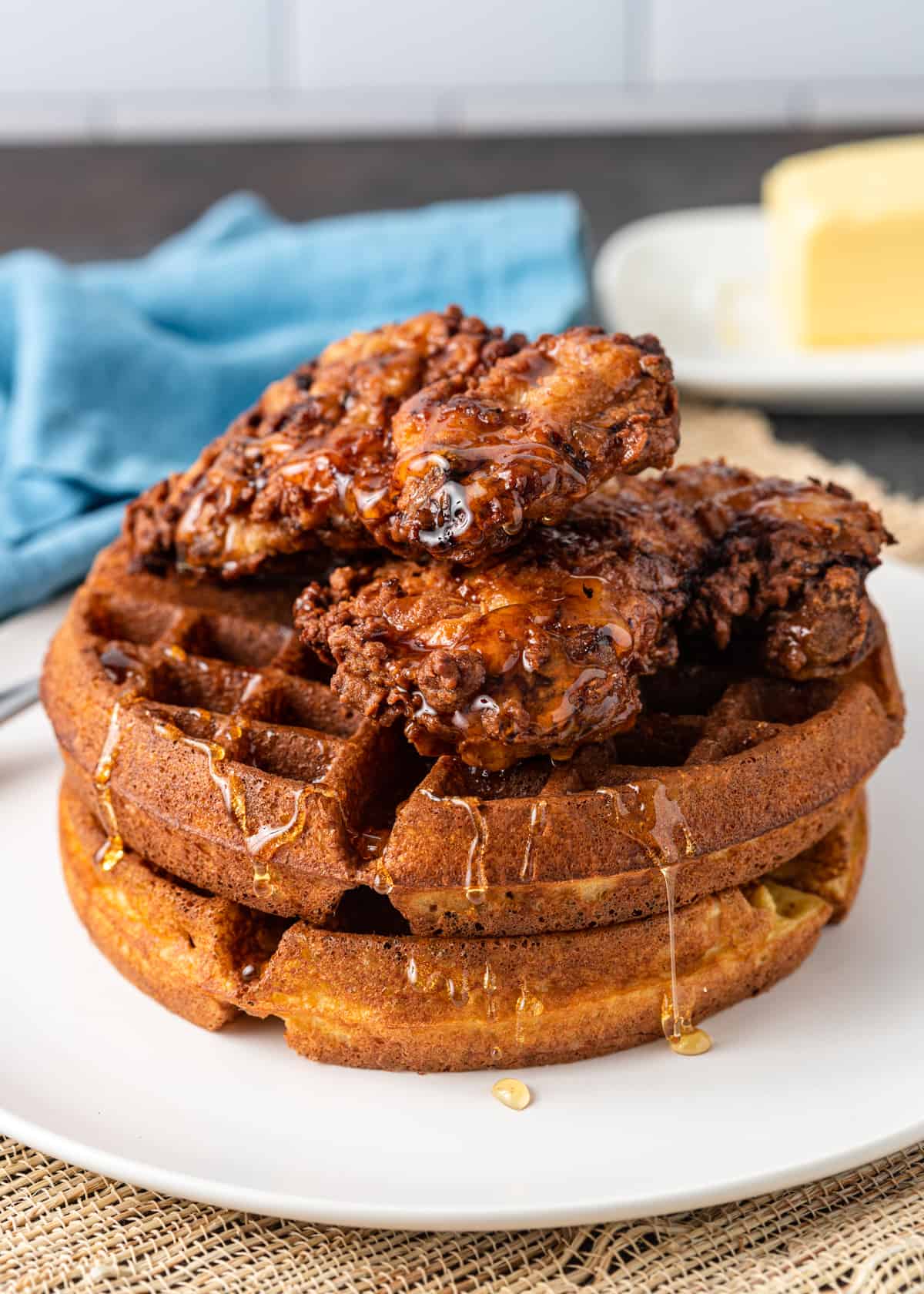 side view of my chicken and waffles recipe on a plate