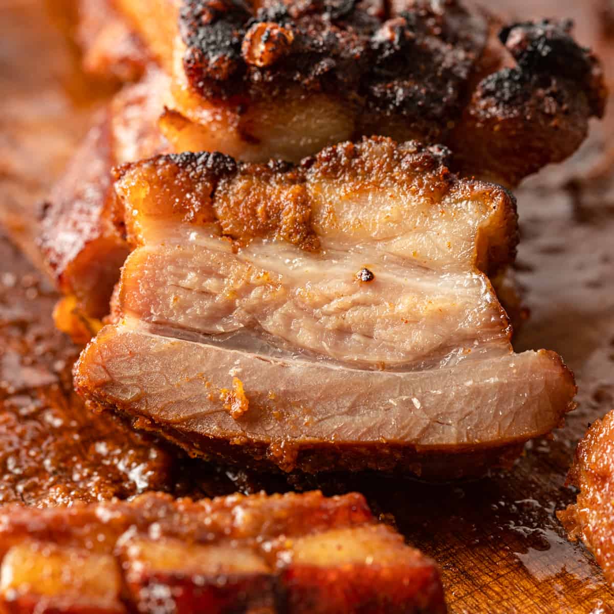 juicy piece of pork belly on a cutting board