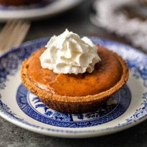 Impress your guests at your next gathering with individual serving mini pumpkin pies! No more worrying about how big to cut your slices. My recipe also features a few unexpected ingredients like sweetened condensed milk and candied ginger.