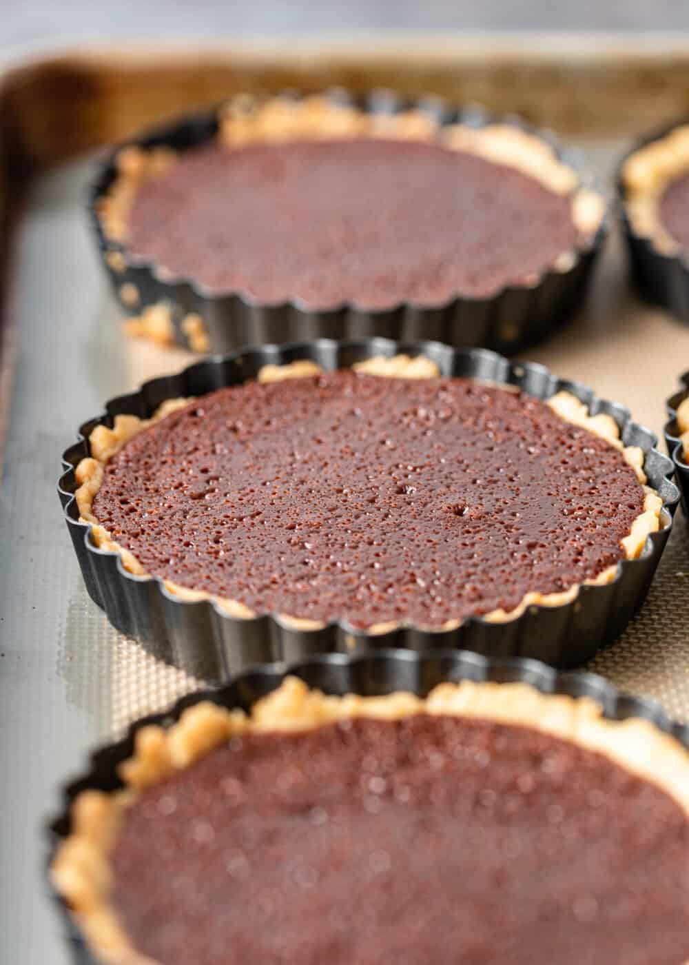 closeup of salted caramel chocolate mini tarts