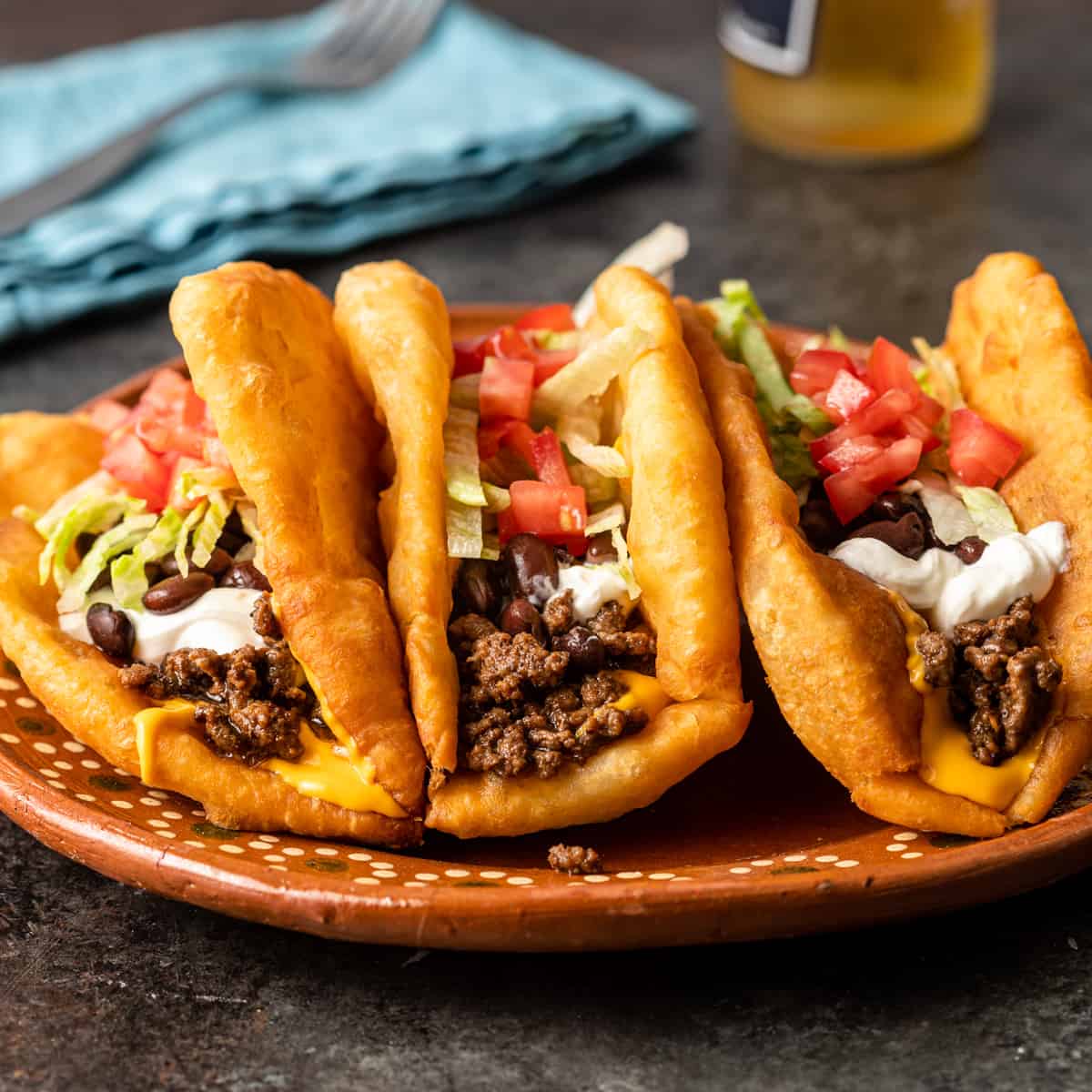 https://keviniscooking.com/wp-content/uploads/2022/08/Navajo-Tacos-Indian-Fry-Bread-square.jpg