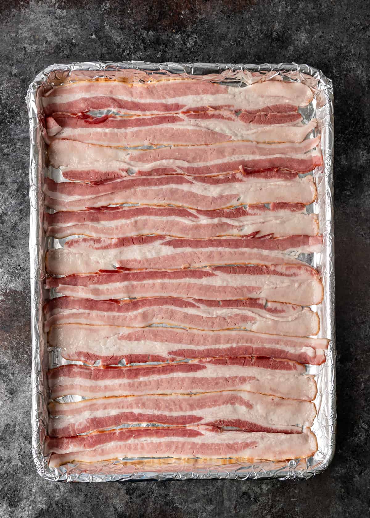 pre-baking bacon on a baking sheet