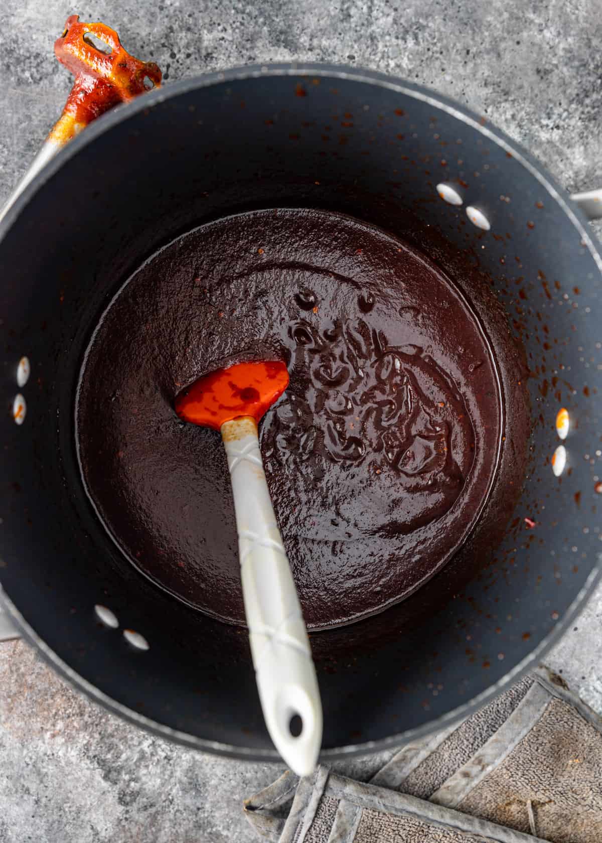 a large pot with BBQ sauce cooking