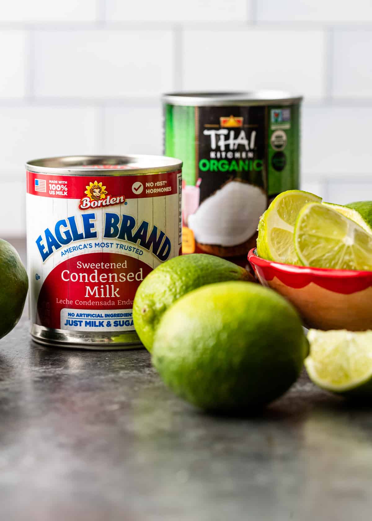 ingredients needed for Brazilian lemonade: condensed milk, coconut milk, and limes