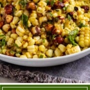 grilled corn and hazelnut salad on plate with herbs