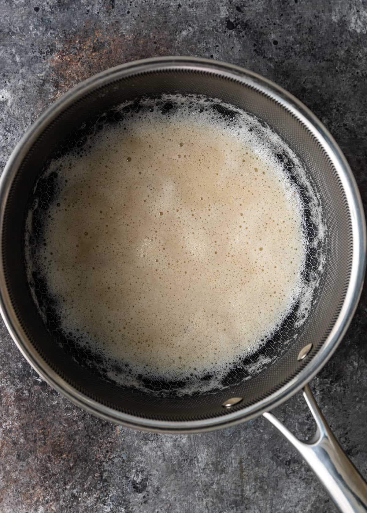 overhead: cooking the bacon fat and flour in a skillet