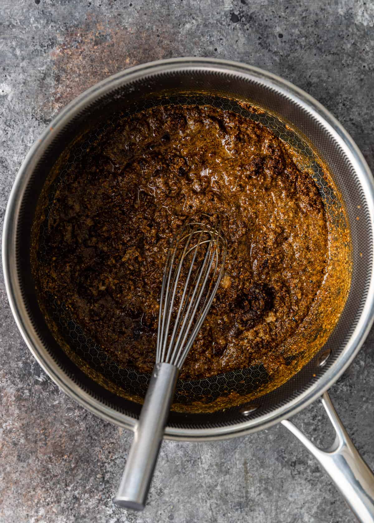 overhead: cooking Mexican brown gravy in a skillet