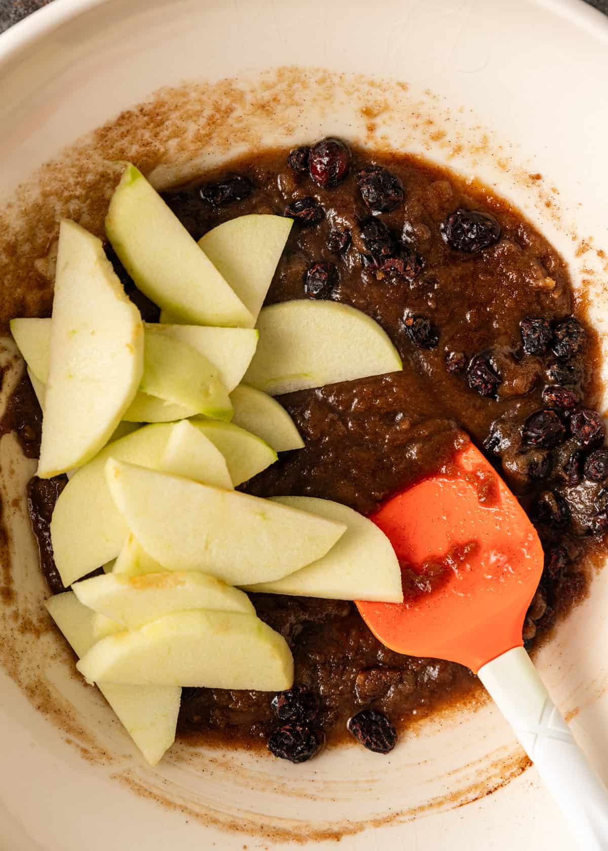 overhead: mixing the apples, raisins, and spiced butter