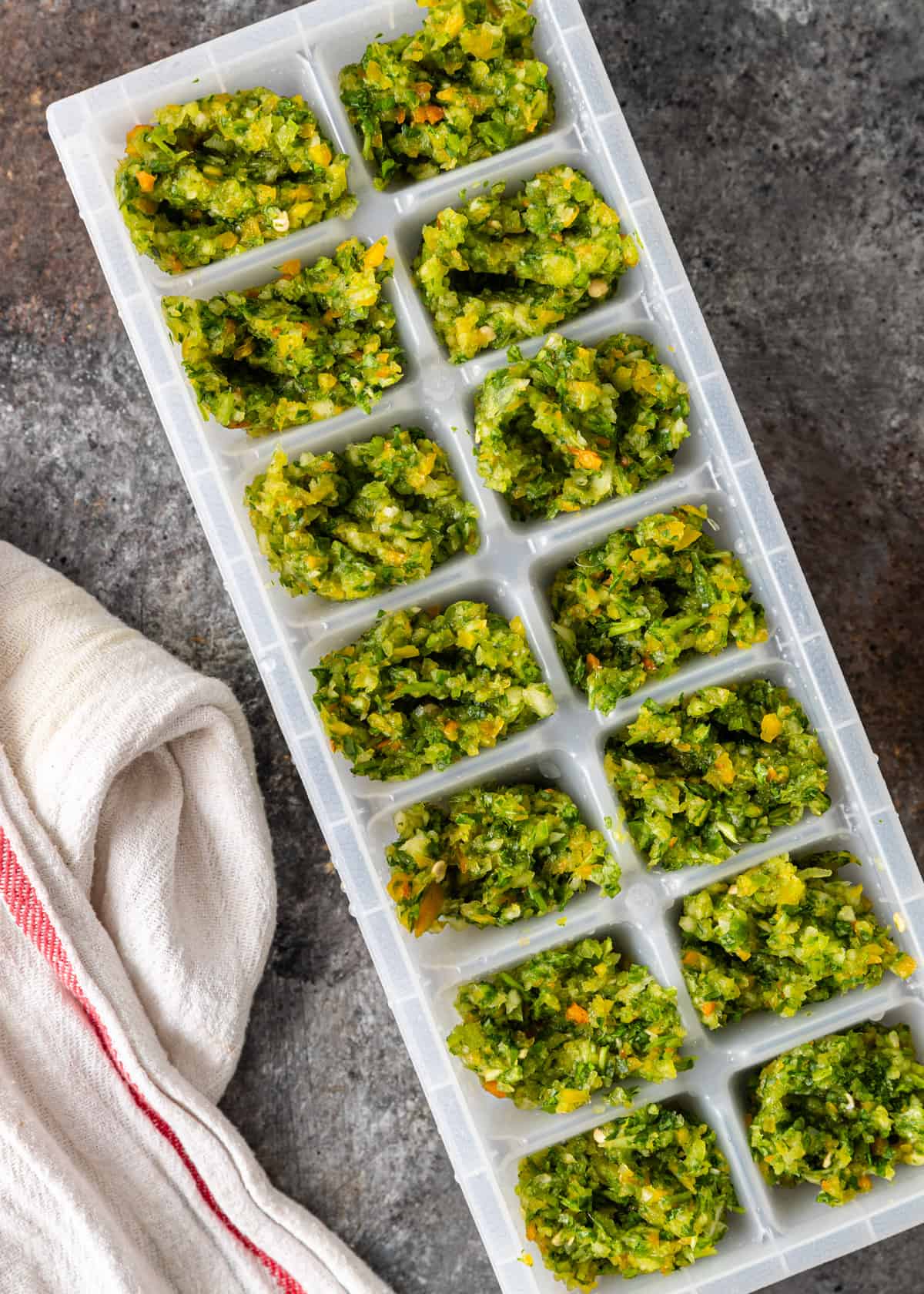 green sofrito in ice cube tray