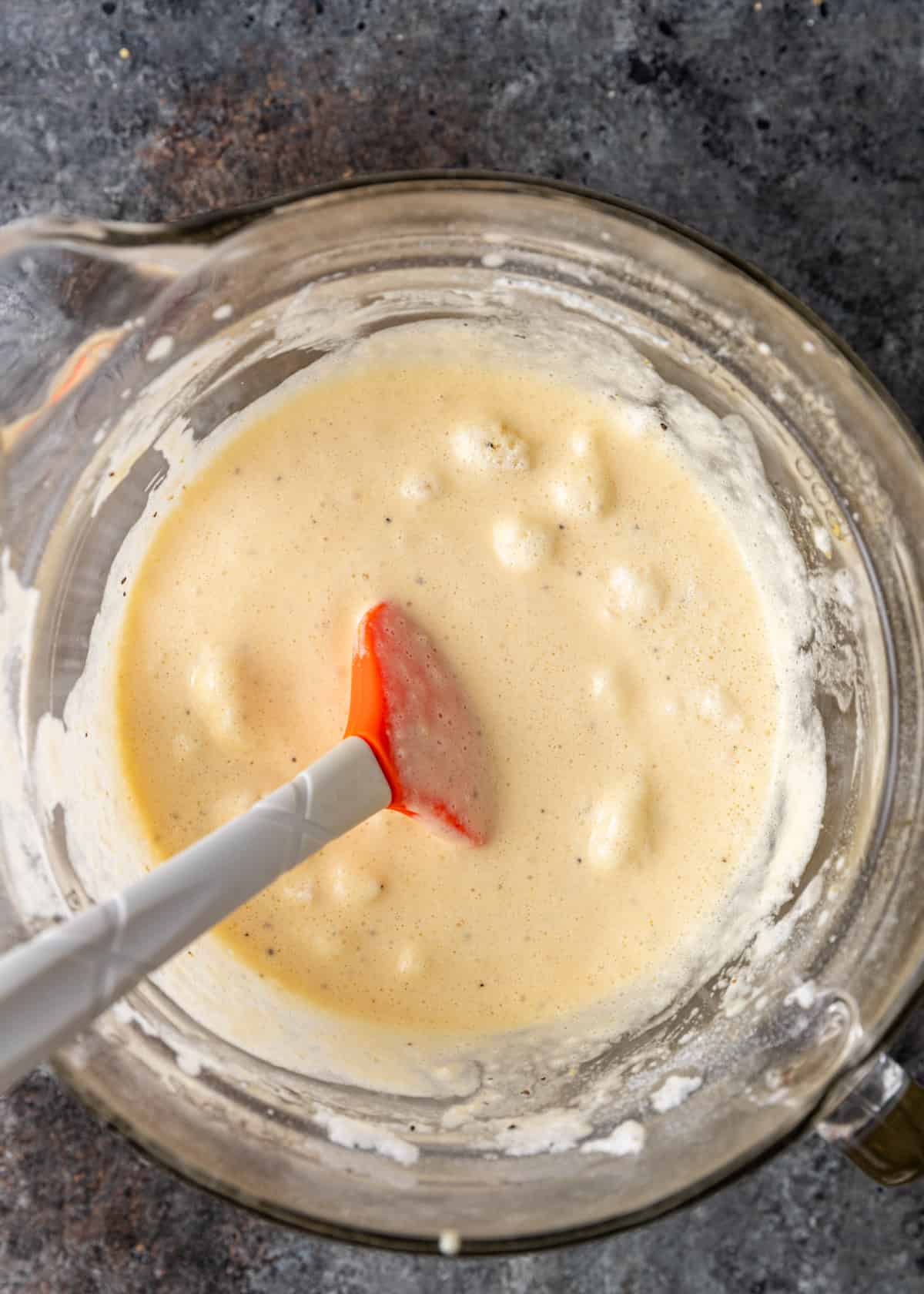 overhead: mixing casserole batter with a spatula